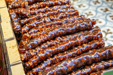 Churchkhela (traditional Georgian candle-shaped candy) for sale at a one of the street markets