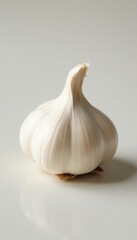 Single garlic clove, skin intact, neutral backdrop, natural, cuisine