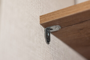 Galvanized steel corners close-up holds a shelf