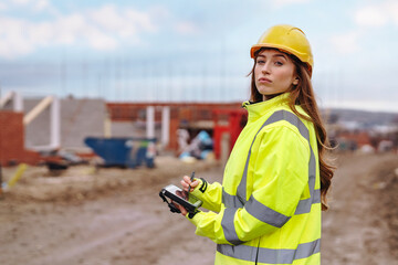 Construction manager conducting site inspection while taking notes