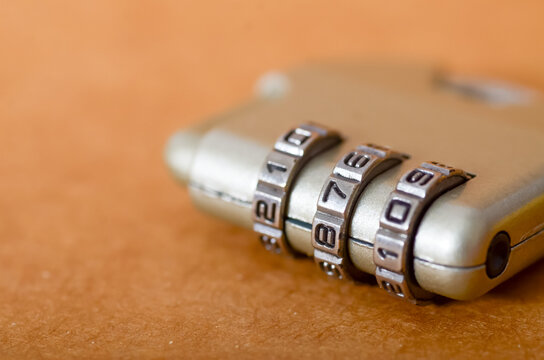 Close-Up of Gold-Toned Combination Lock Symbolizing Security and Protection