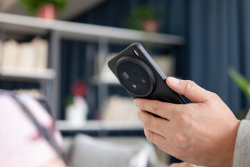 asian businessman using smart phone in office
