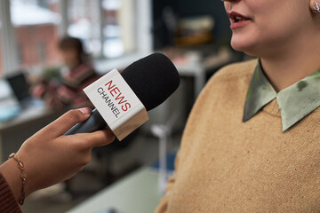 Close-up of woman having an interview with journalist in office