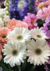 Obraz premium Beautiful bouquet of gerbera daisies and assorted colorful flowers in a vibrant floral arrangement, perfect for celebrations and decorations.