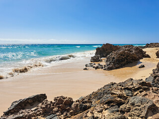 calm ocean waves and rocky coast in Fuerteventura