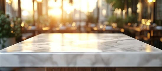  Beautiful marble tabletop with a blurred background of a restaurant interior in golden sunlight.
