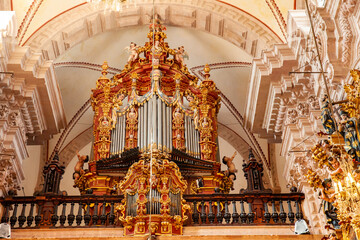 Obraz premium Beautiful choir organ, built in 1760, located above the main entrance of the Santa Prisca church of Taxco de Alarcon.