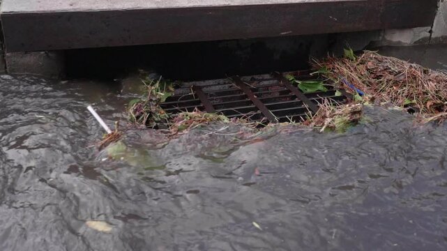 Slow Motion Shot of Drainage Ditch Draining Water