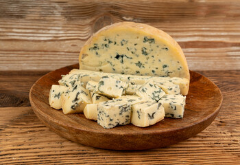 Fourme cheese, stinky french cheese, Fourme d'Ambert gourmet food, semi-hard blue cheese
