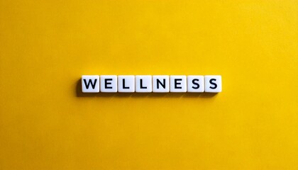Obraz premium Wellness word banner letter tiles on yellow background isolated modern simple aesthetics