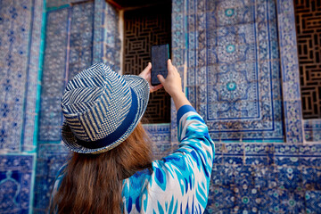 Woman tourist at old city Khiva in Uzbekistan