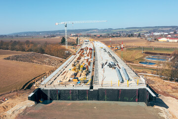Construction of Highway D35, including the installation of a new concrete bridge.