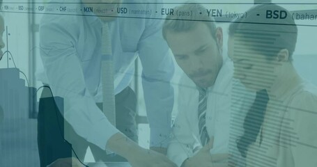 Analyzing financial data, business team reviewing currency exchange rates in office