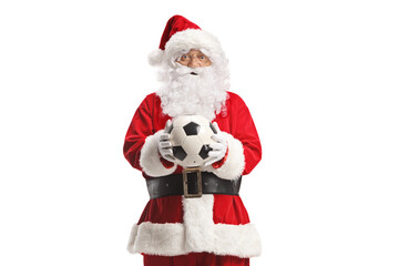 Santa claus standing and holding a football