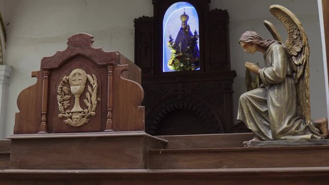 Church interior in Sri Lanka with statues and sculptures
