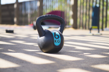 kettlebell resting on the ground in public park