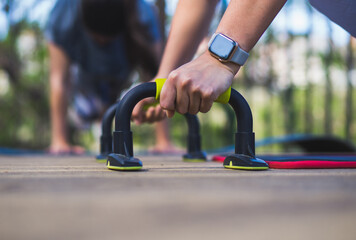 close-up of girl doing push-ups with smart watch