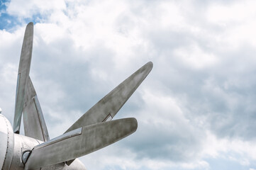 Retro airplane propeller under a cloudy sky