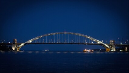 Fototapeta premium Gleaming metallic bridge at night signifies connection and unity