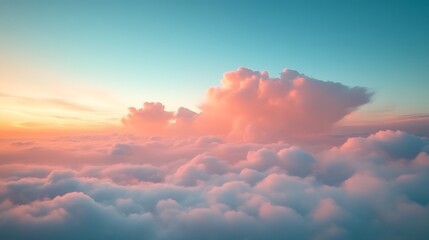 Pink cloudscape at sunset above a sea of clouds