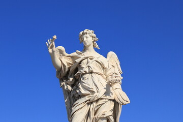 Angel with the Nails Statue Close Up at Ponte Sant'Angelo Bridge in Rome, Italy