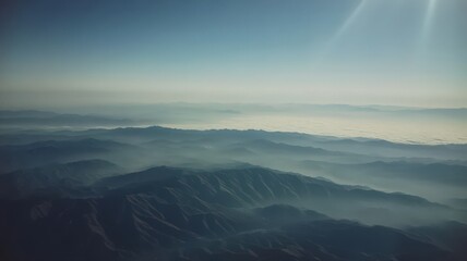 Obraz premium Aerial View Of Misty Mountain Range At Sunrise