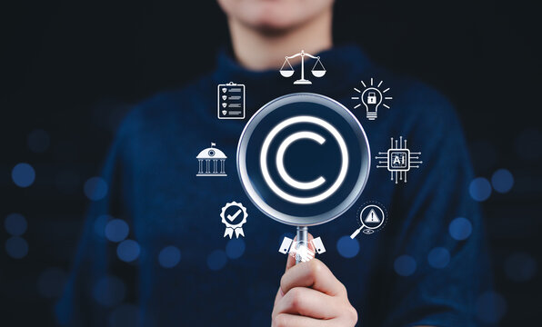 Patented intellectual property. Digital copyright or patent concept. Woman holding magnifying glass focuses on copyright symbol surround by legal icons. trademark license, Author rights, law business,