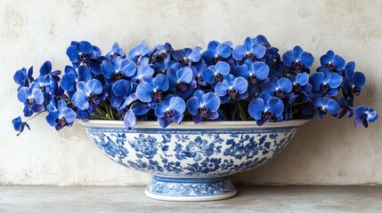 Vibrant blue orchids in ornate bowl