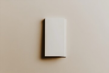 A white tri-fold brochure mockup on a beige background