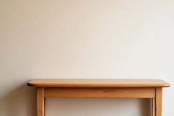 Empty wooden table against a beige wall