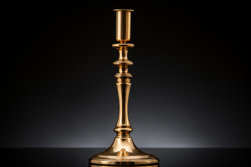 Elegant gold candlestick holder placed on a reflective surface against a dark background, enhancing the luxurious ambiance and aesthetic appeal.