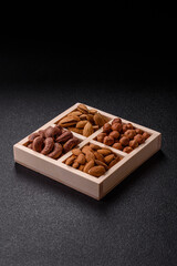 Wooden box with four sections filled with nuts