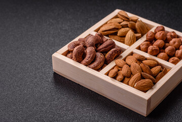 Wooden box with four sections filled with nuts