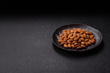 Roasted or raw peeled almonds in bowl