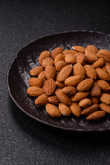 Roasted or raw peeled almonds in bowl