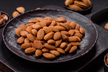 Roasted or raw peeled almonds in bowl
