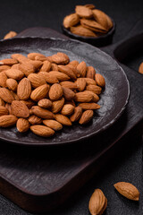 Roasted or raw peeled almonds in bowl