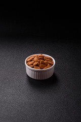 Roasted or raw peeled almonds in bowl