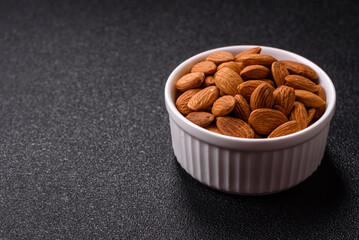 Roasted or raw peeled almonds in bowl