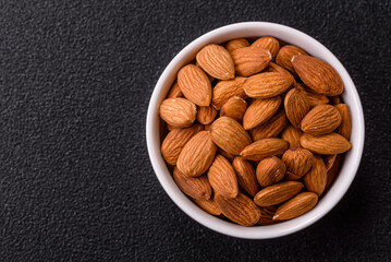 Roasted or raw peeled almonds in bowl