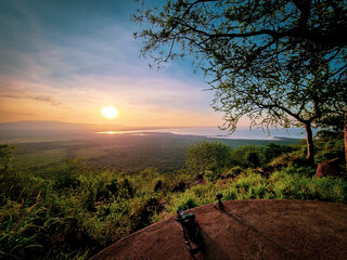 A Stunning Sunset Majestically Overlooking the Verdant Valley Landscape that Inspires Awe Lake...