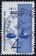 U.S. postage stamp from 1961 marking 50 years of Wisconsin’s Workmen’s Compensation Law,...