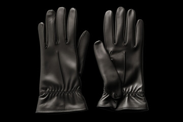 Obraz premium A pair of elegant black leather gloves displayed against a dark background, showcasing sleek design and fine craftsmanship, ideal for winter fashion accessories.
