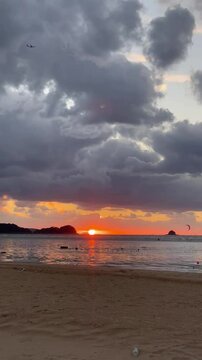 sunset on the beach airplain wave sufer