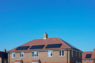 Close Up Of New Housing Development Including Solar Energy Panels On Roof