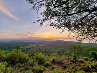 Enjoy the tranquility of a sunset over a green landscape, immersed in natures beauty Lake Manyara...