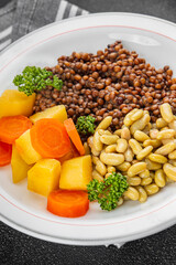 Lentils and vegetables vegetarian main course, bean, potatoe, carrot tasty fresh gourmet food background on the table rustic food top view copy space keto and paleo diet vegetarian and vegan food