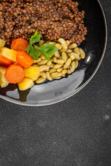 Lentils and vegetables vegetarian main course, bean, potatoe, carrot tasty fresh gourmet food background on the table rustic food top view copy space keto and paleo diet vegetarian and vegan food
