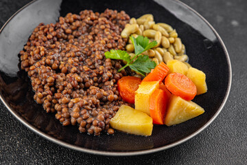 Lentils and vegetables vegetarian main course, bean, potatoe, carrot tasty fresh gourmet food background on the table rustic food top view copy space keto and paleo diet vegetarian and vegan food