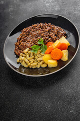 Lentils and vegetables vegetarian main course, bean, potatoe, carrot tasty fresh gourmet food background on the table rustic food top view copy space keto and paleo diet vegetarian and vegan food